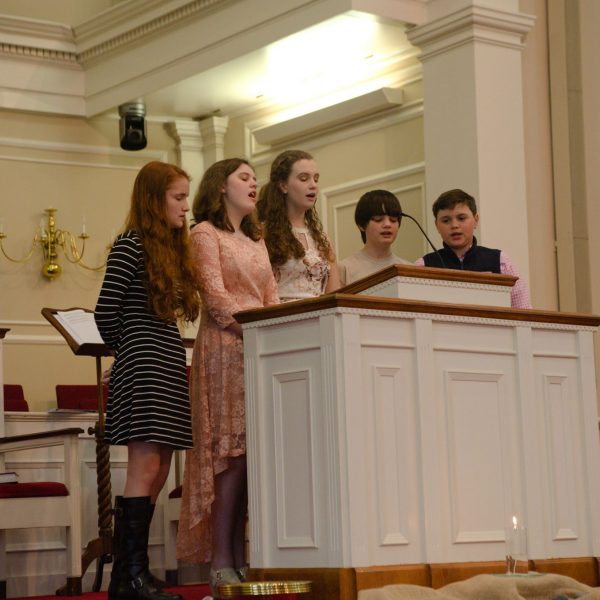 teenagers singing in traditional worship